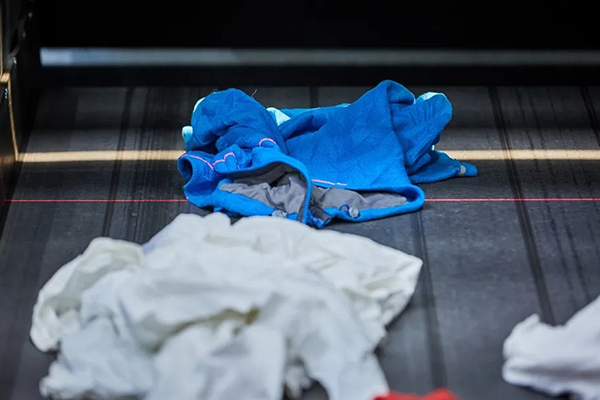 Waste textile processing solution